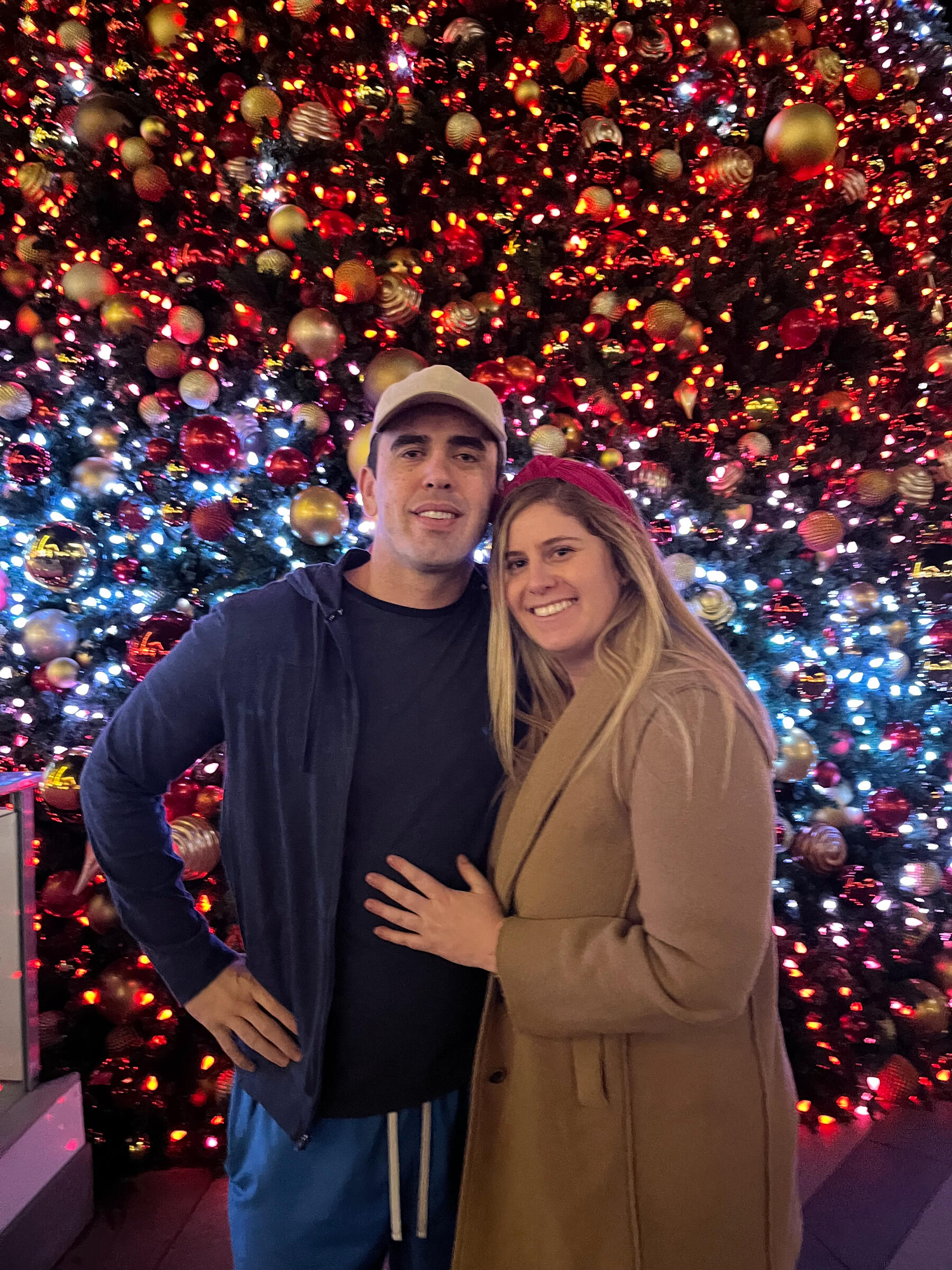 Will and Cambria by a Christmas tree